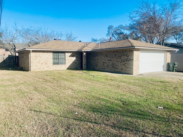 Single story home featuring a garage, brick siding