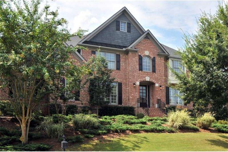 Quality abounds in this 3 side brick traditional h
