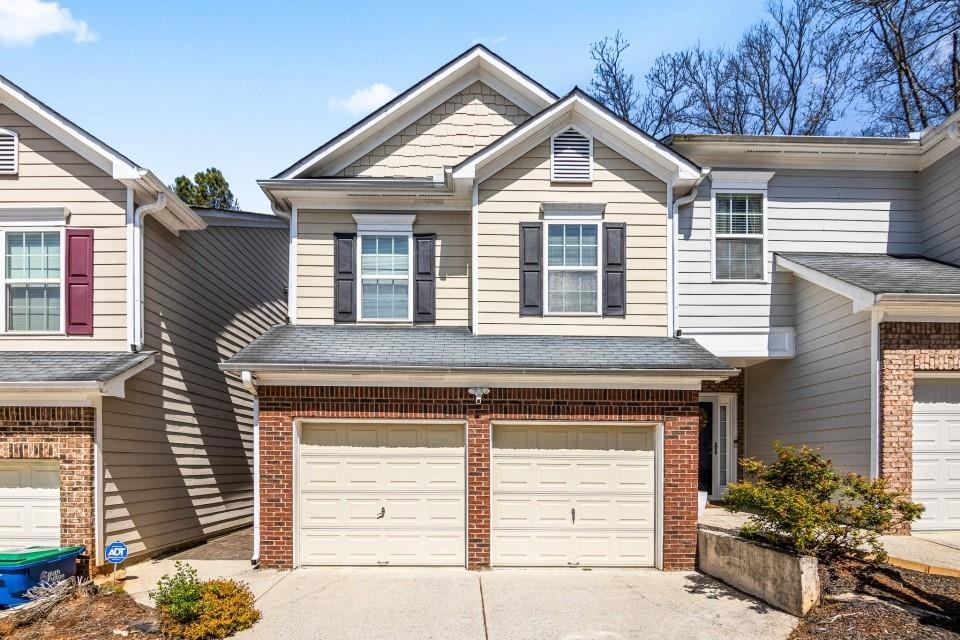 View of property featuring a garage