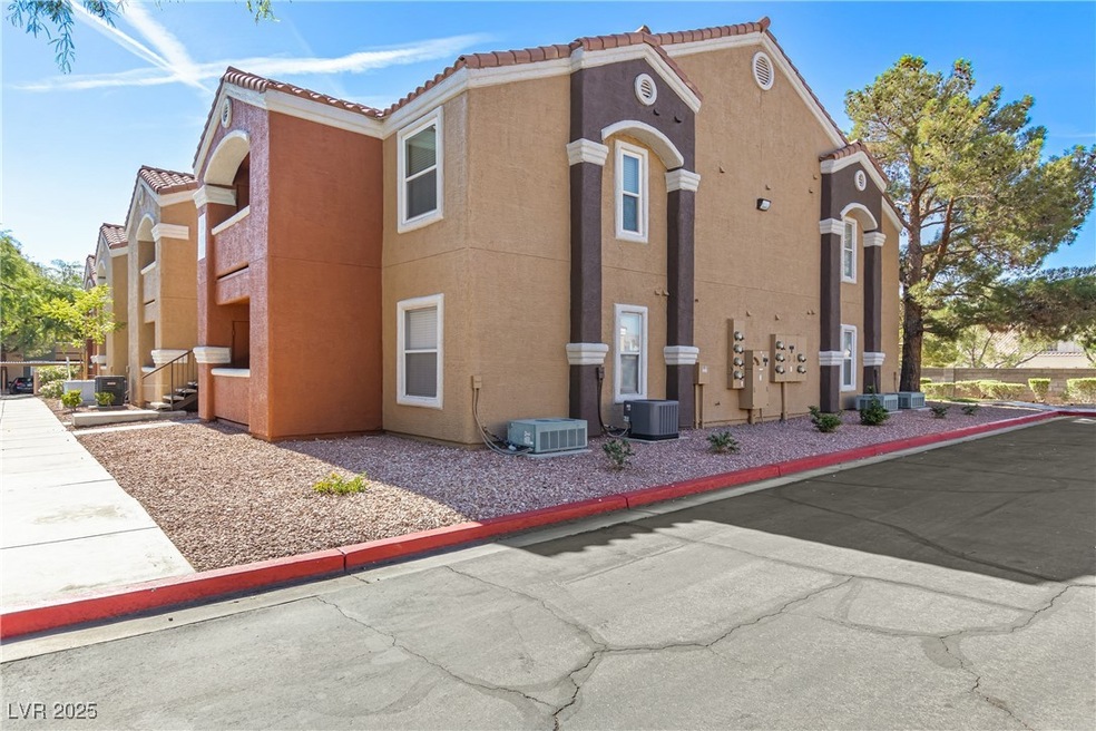 View of side of home with stucco siding and a tile