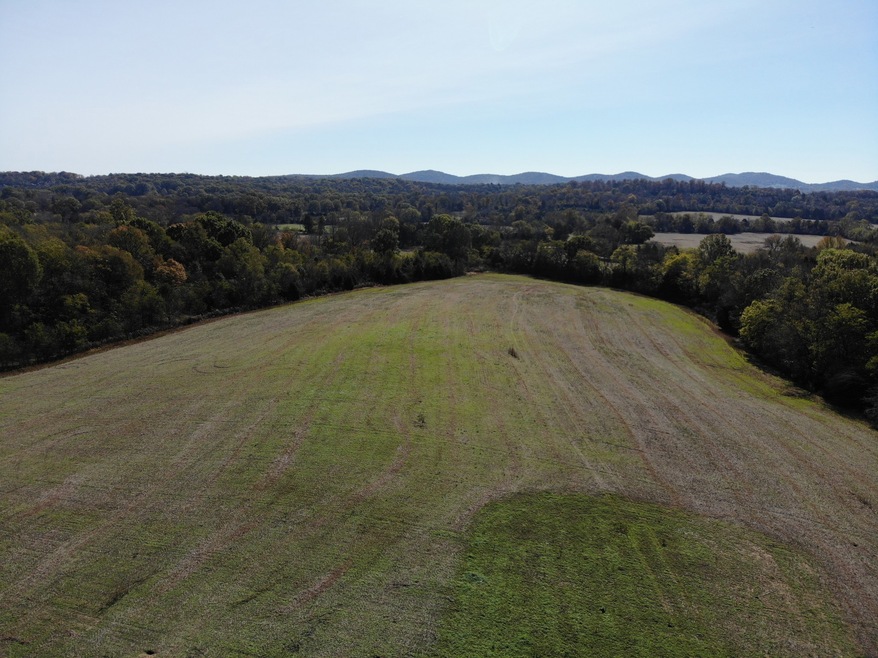 Photos depict larger tract as a whole and not necessary of exact acreage listed.