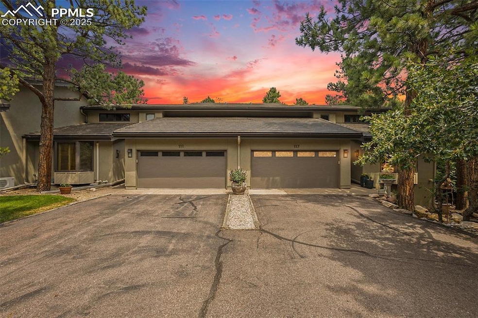 Prairie-style home with stucco siding, a garage, a