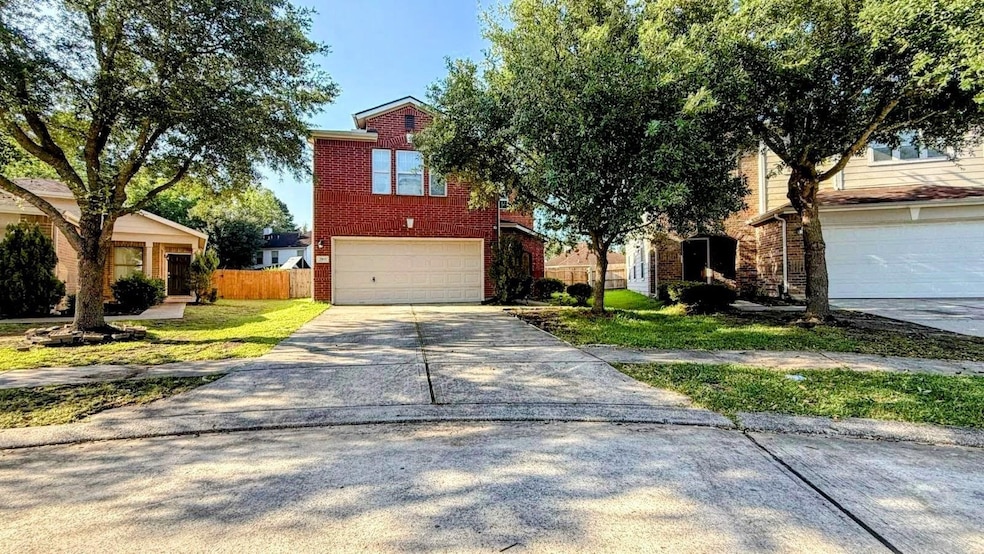 Front of the Two-story brick house with a double g