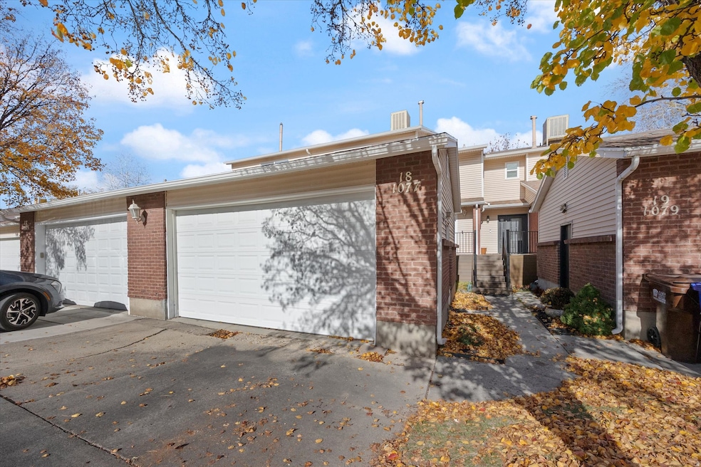 View of front of house with brick siding and a garage