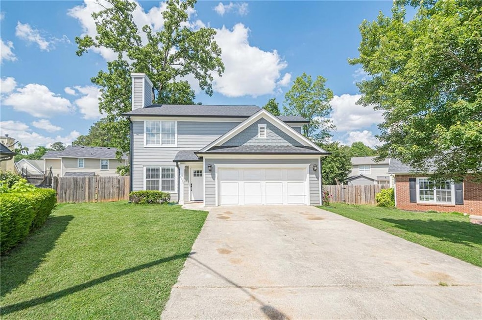 Traditional-style house with an attached garage, a