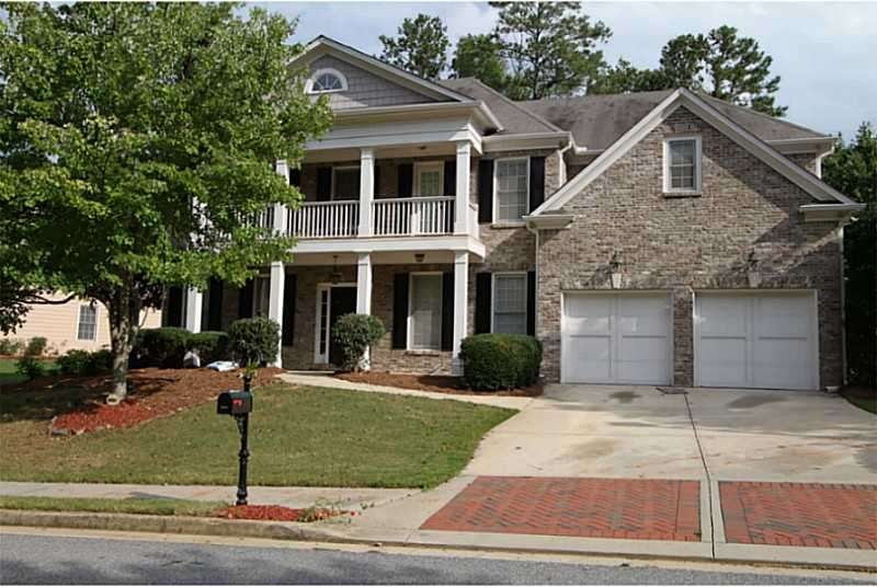 Exterior Front. Beautiful traditional home with ba