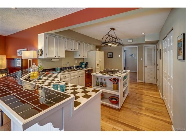 Tile counters, Island, and a bar. All open to the 