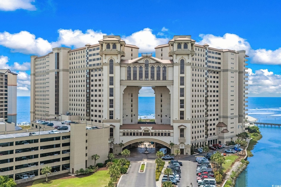 View of apartment building / complex featuring a water view