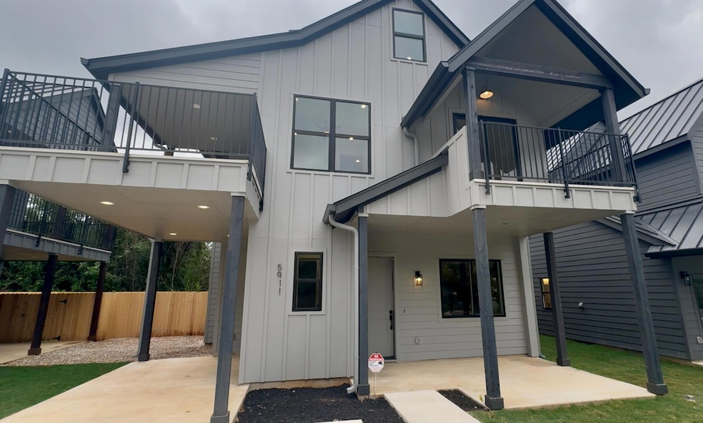 Rear view of property featuring board and batten 