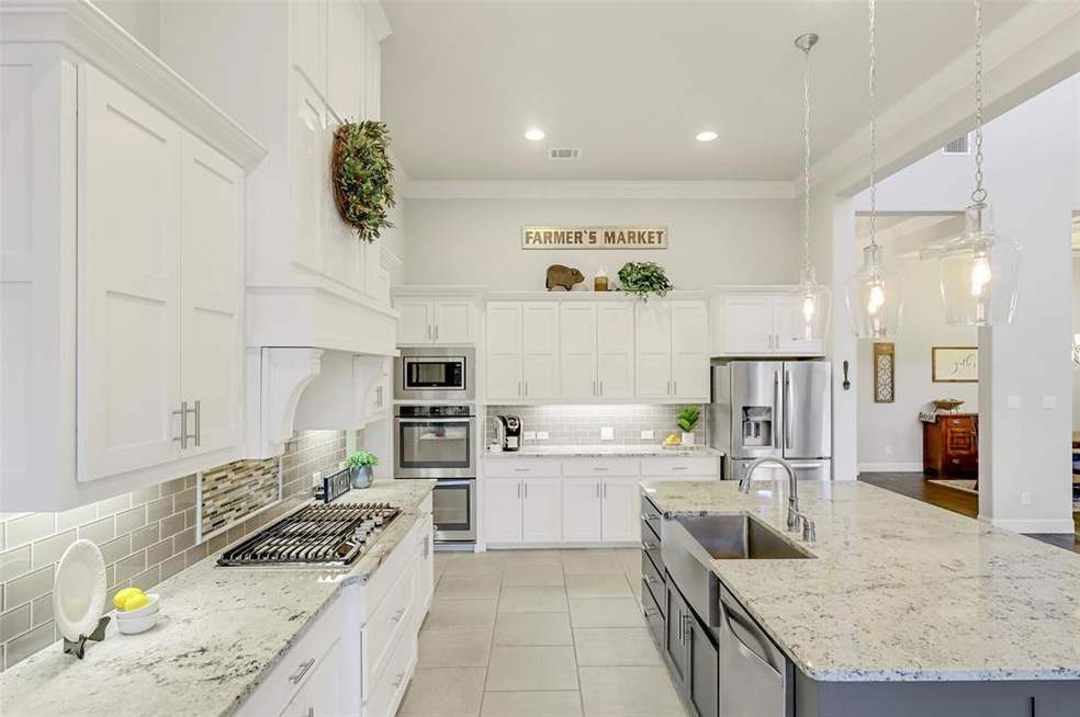 The richly appointed Kitchen offers granite counte