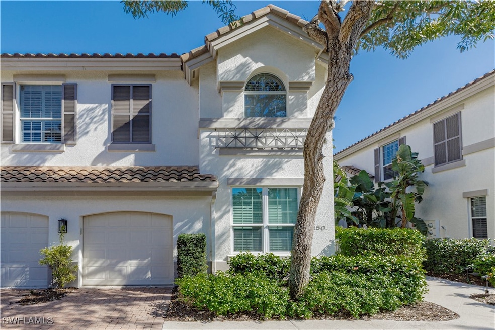 Mediterranean / spanish-style house featuring a ga