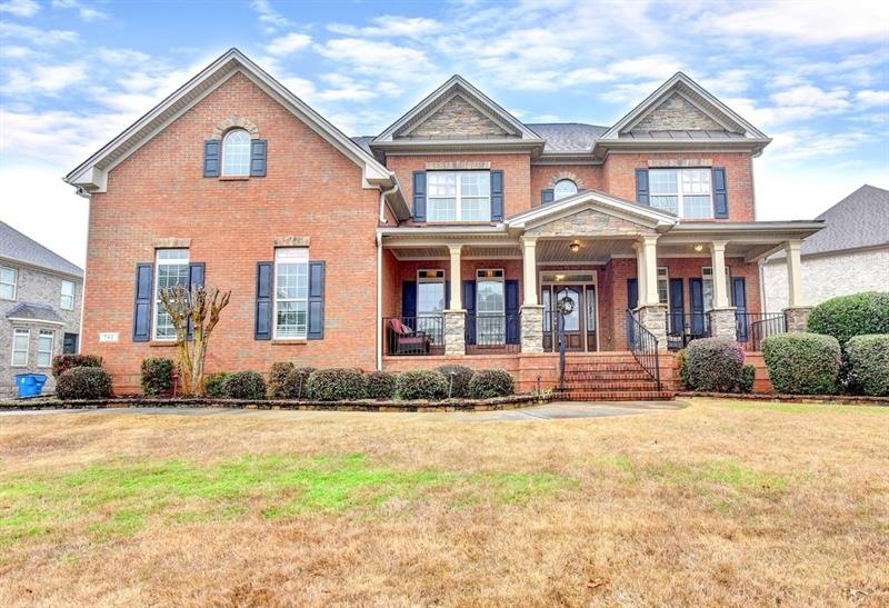 Gorgeous all-brick home with stunning front porch.