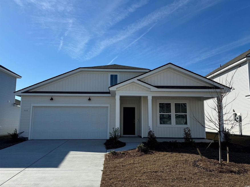 View of front facade featuring driveway and an att