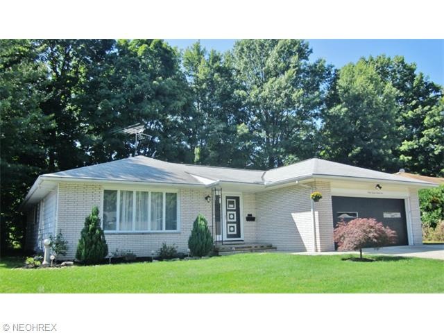 Pristine Ranch home with a private wooded lot.