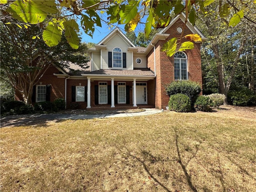 Front facade featuring a front lawn