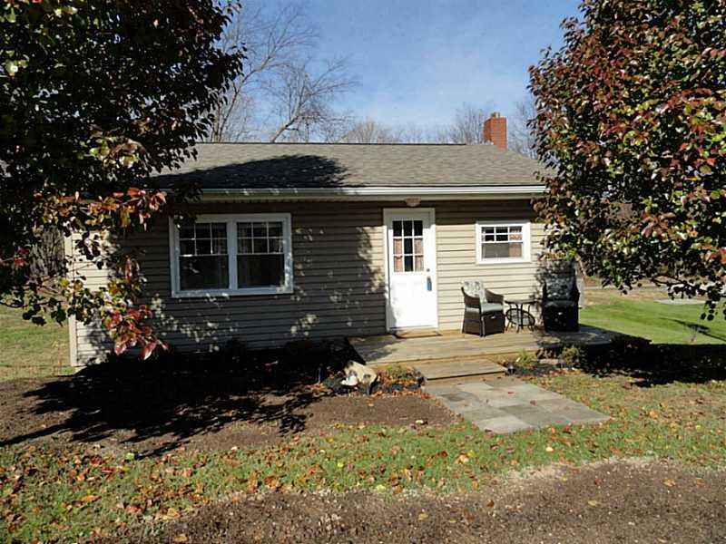 Exterior Front. Nicely maintained vinyl sided ranc