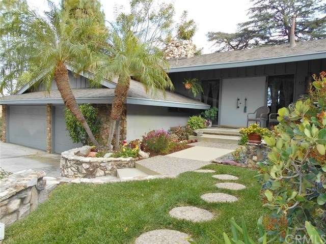 Home! Lovely front entrance  is graced by a triple