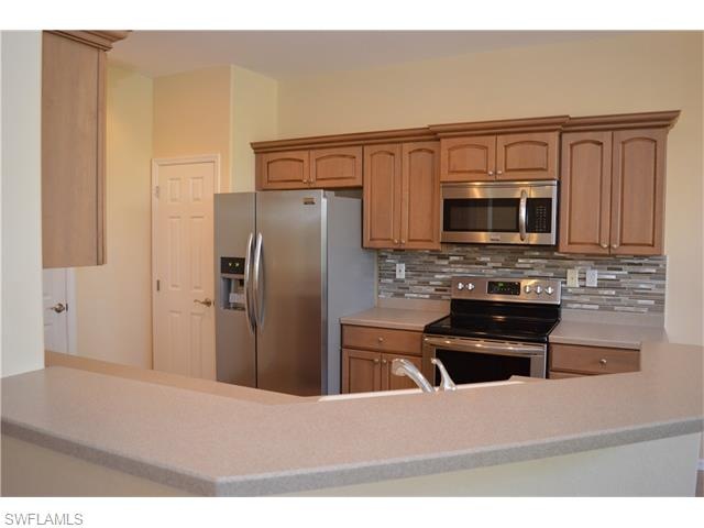 12870 Carrington Cir unit 203, Naples, FL 34105 - photo 1