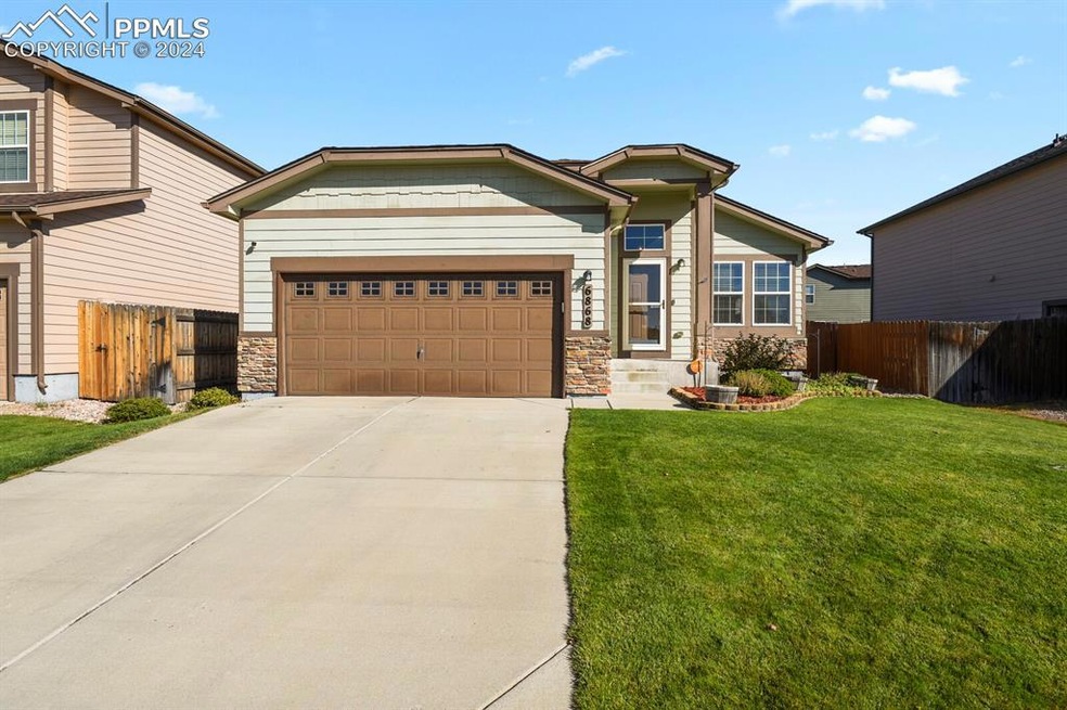 View of front of property with a garage and a fron