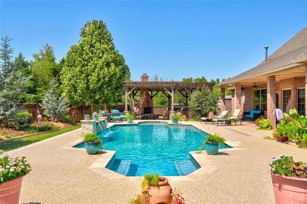 View of swimming pool with a pergola, ceiling fan,