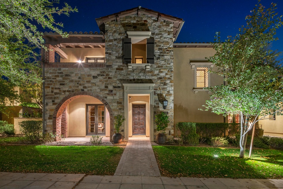 Stone clad front entry facing a park