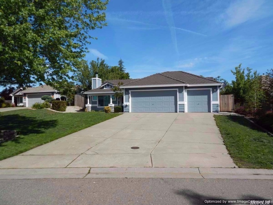 Single-story home with a 3-car garage on a deep lot.