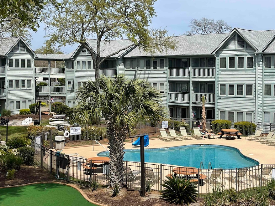 Pool featuring a patio area and fence