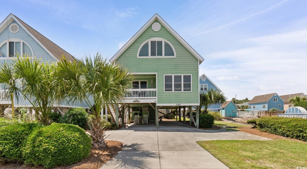 View of front of property featuring a carport