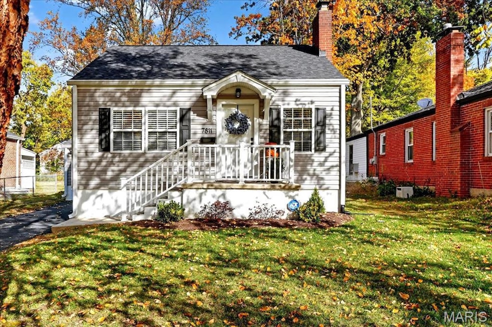 View of front of property with a front lawn and a chimney