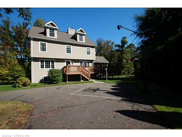 Exterior Front. A circular driveway welcomes you t
