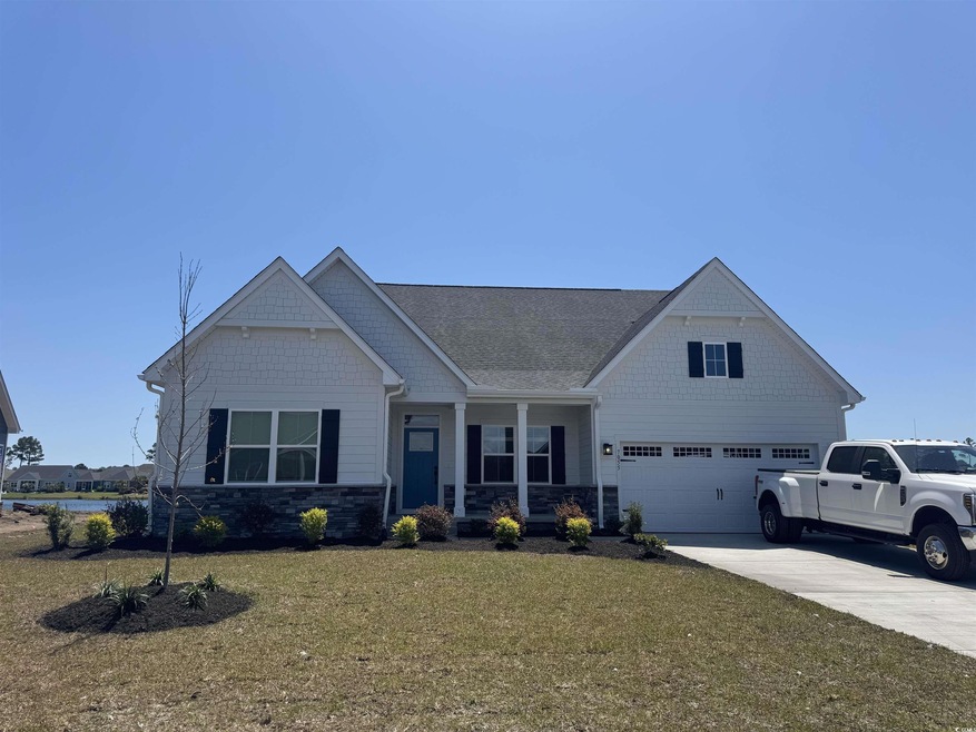 View of front of home featuring stone siding, a po