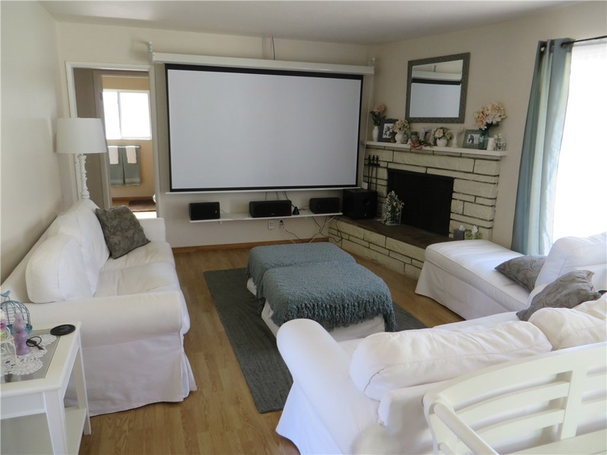 Living room. Note, this is an older photo.  Projection TV screen has been removed.