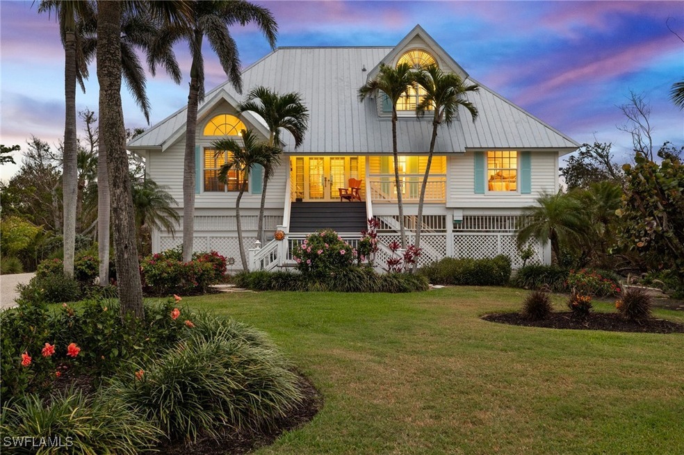 View of front of property featuring a yard, a porc