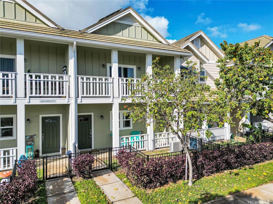 Fenced in front entrance with a private yard
