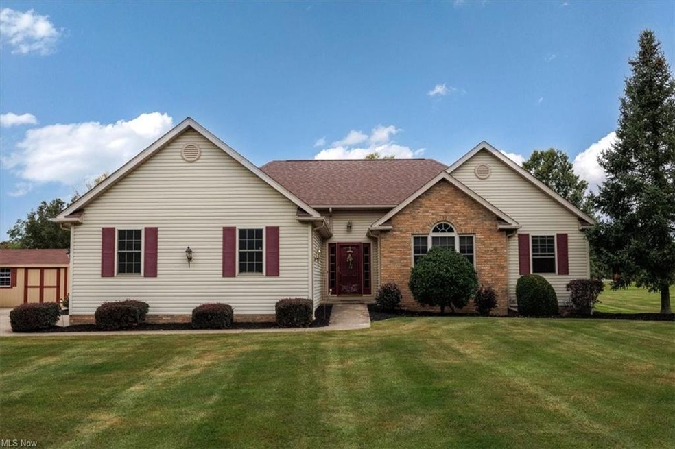 Single story home with a front yard