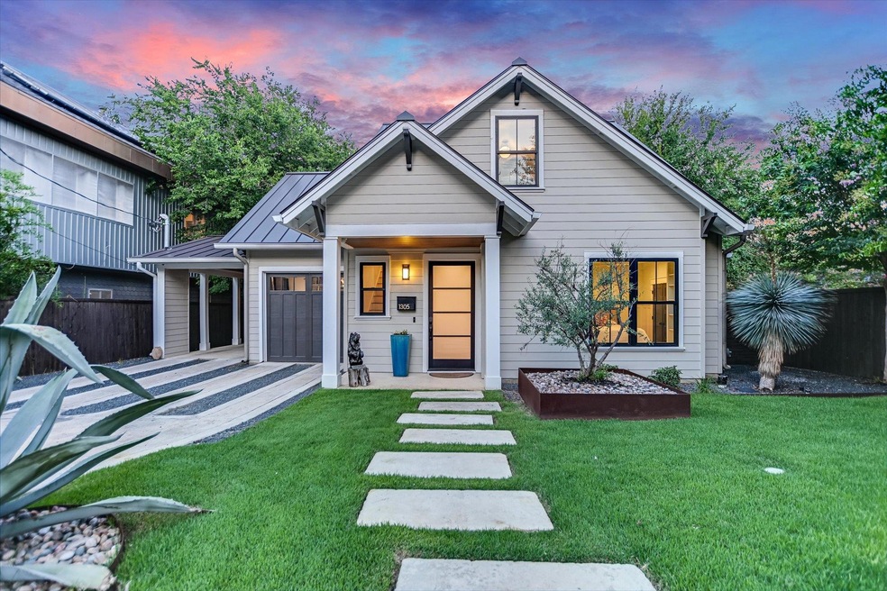 View of front of home with an attached garage, a 