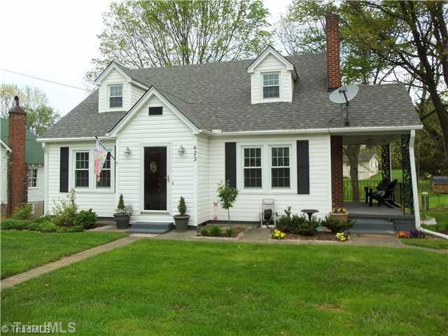 Exterior Front. cute as button front lawn