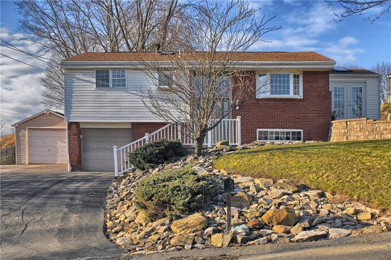 property front with one plus detached garage