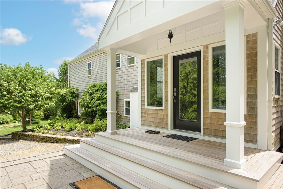 Entry from the large driveway and patio