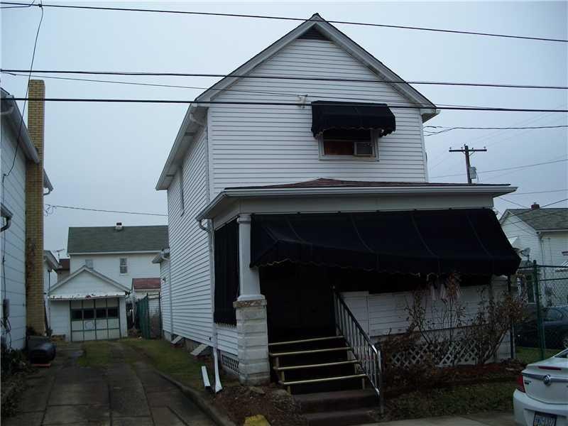 Exterior Front. Aluminum sided home with Much pote