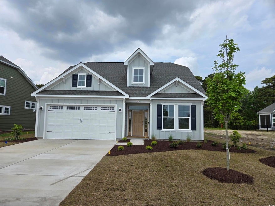 View of front facade featuring driveway, board and