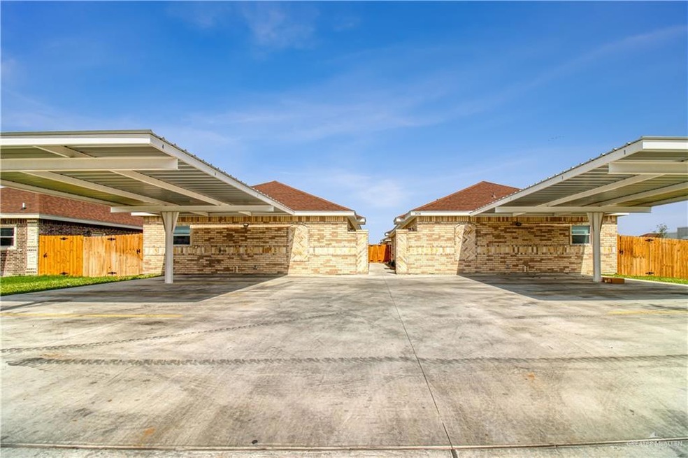 View of property exterior with 2 carports per unit