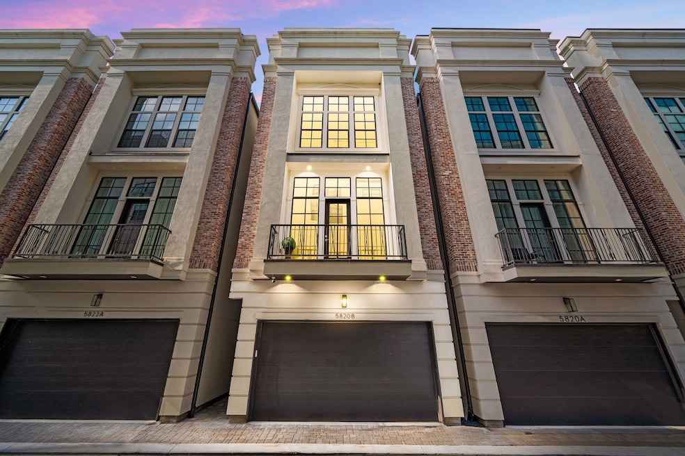Modern townhouse with a stylish brick and stucco f