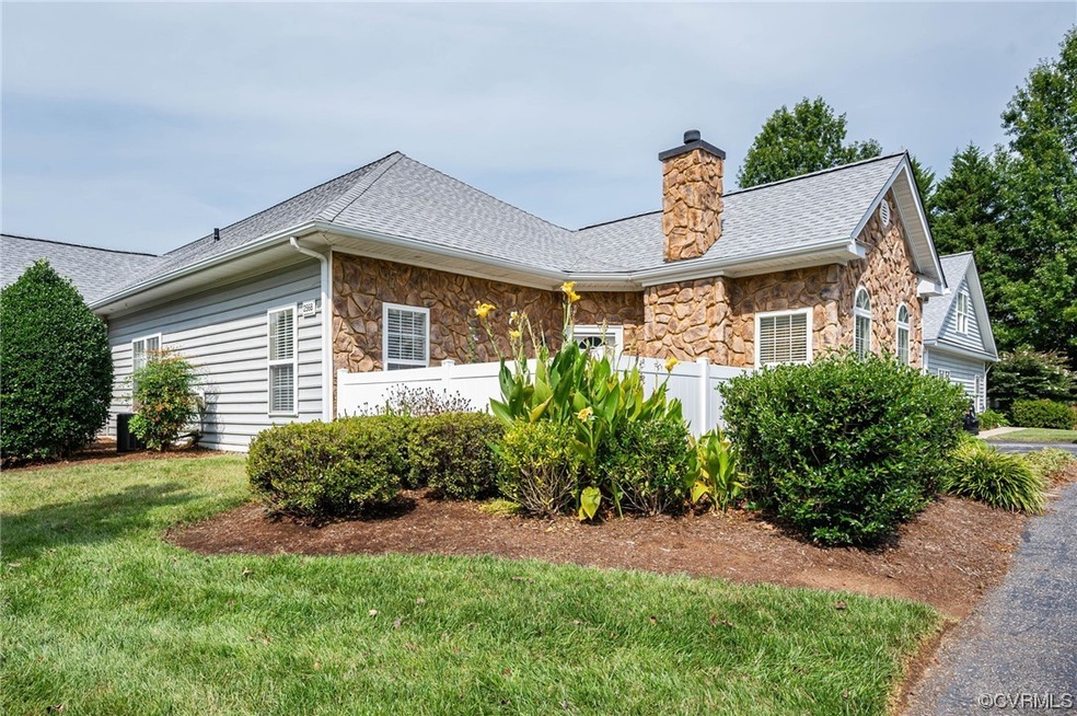 Single story home featuring a front lawn