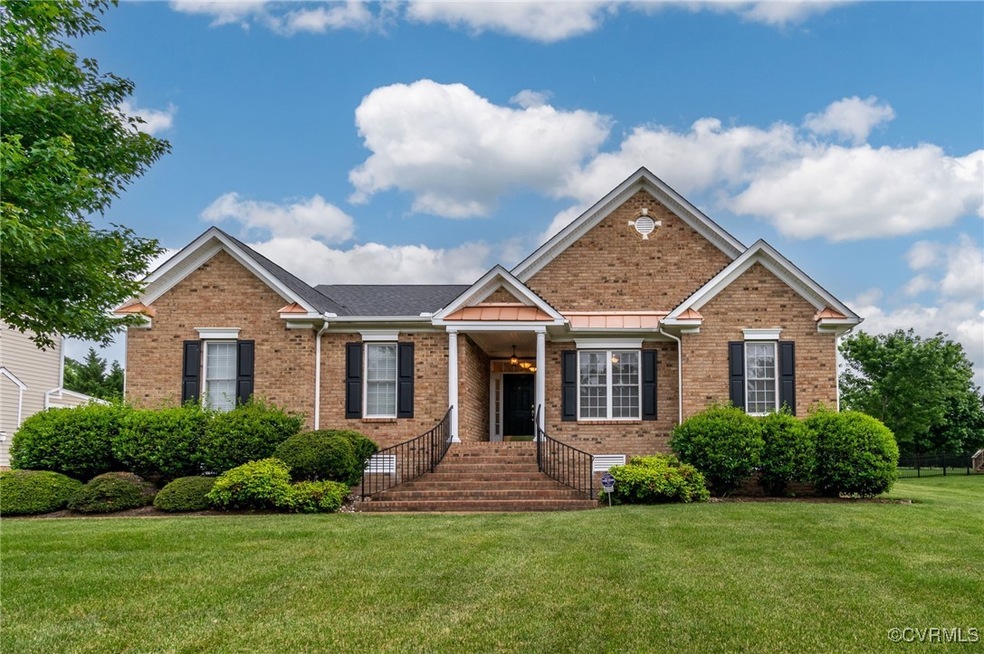 View of front of property featuring brick siding a