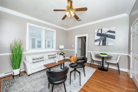 Living room featuring ornamental molding, wood fin