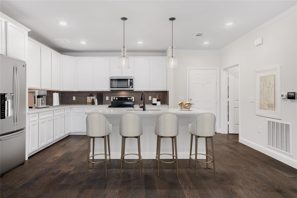 This home opens to a gorgeous kitchen with white c