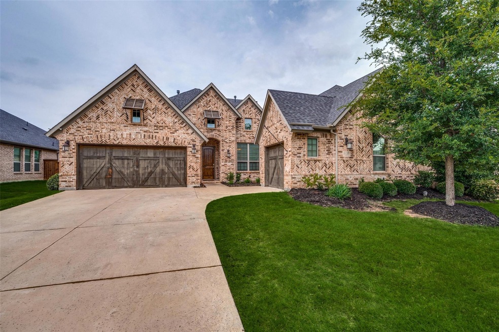 View of front of property with a front yard and a 
