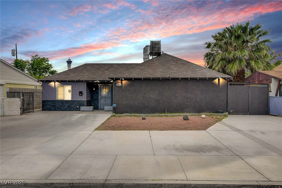 Ranch-style home with stucco siding, roof with shi