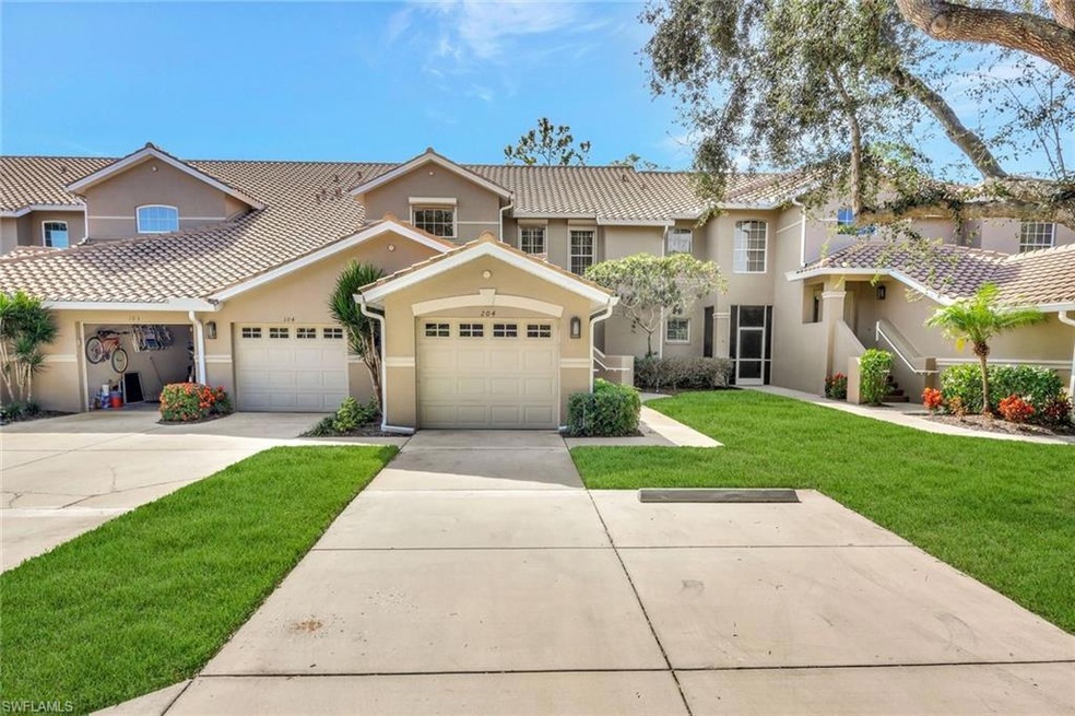 View of front of home featuring stucco siding, driveway, a front lawn, a garage, and a tiled roof
